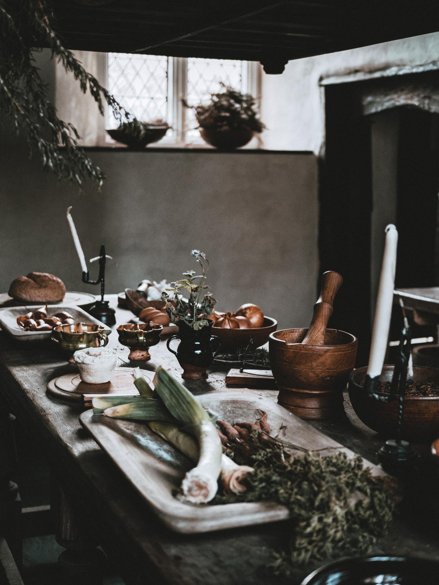 Interior of intimate cooking studio with wooden table