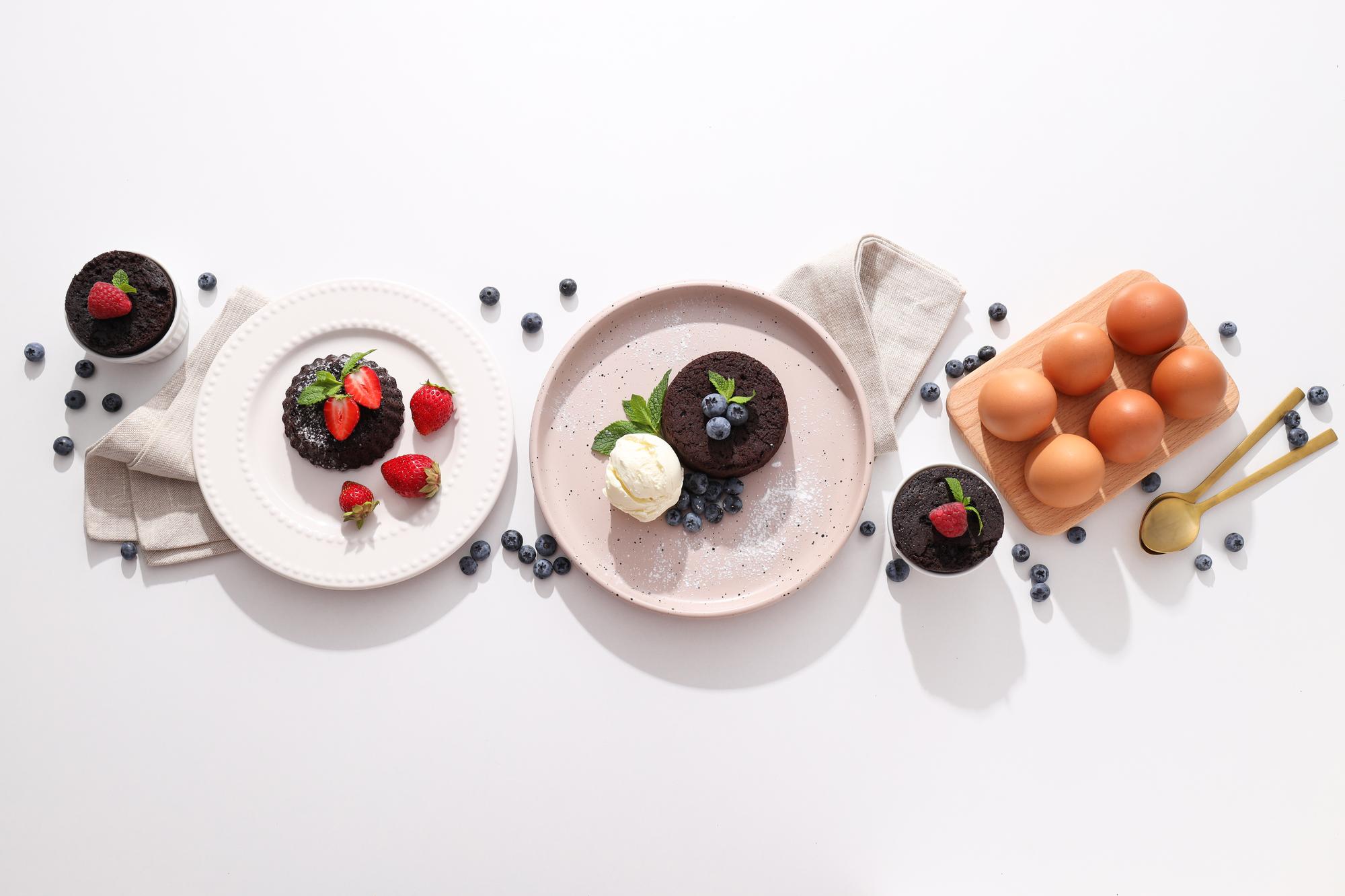 Row of plated desserts on simple plates